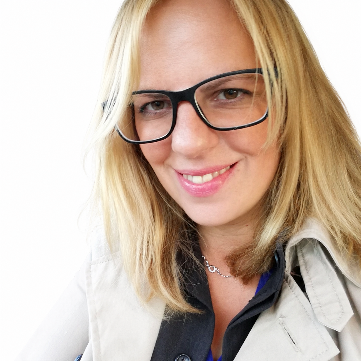 A professional and welcoming headshot of the founder